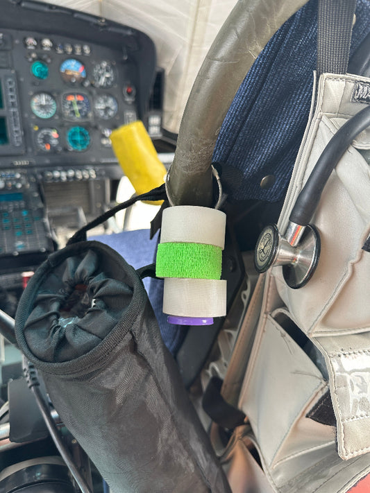 tape holder hanging on the seat handle by a steel-braided clasp