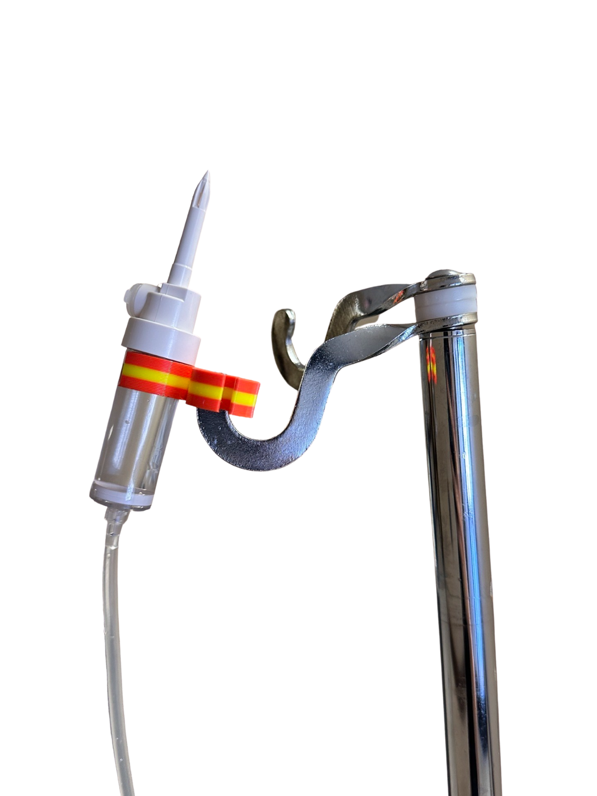 Close-up of a drip chamber in a red and yellow holder hanging on an IV pole hook