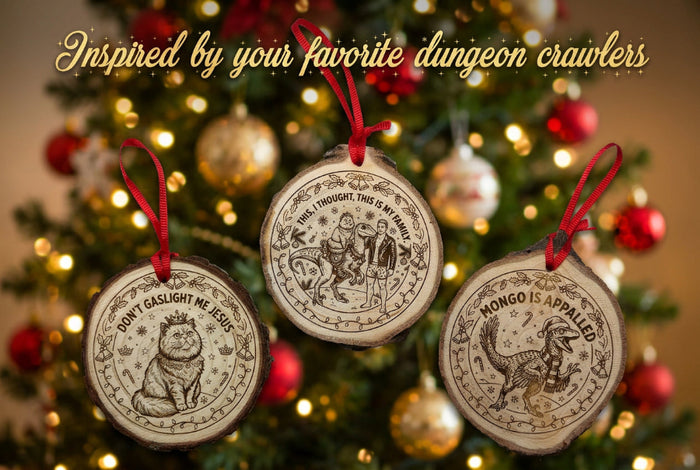 Three round wooden Christmas ornaments with red hanging loops, featuring engraved animal illustrations and text including 'JON GASLIGHT ME JESUS' and 'NONGO IS APPALIED.' They are arranged on a white surface above a green cutting mat.