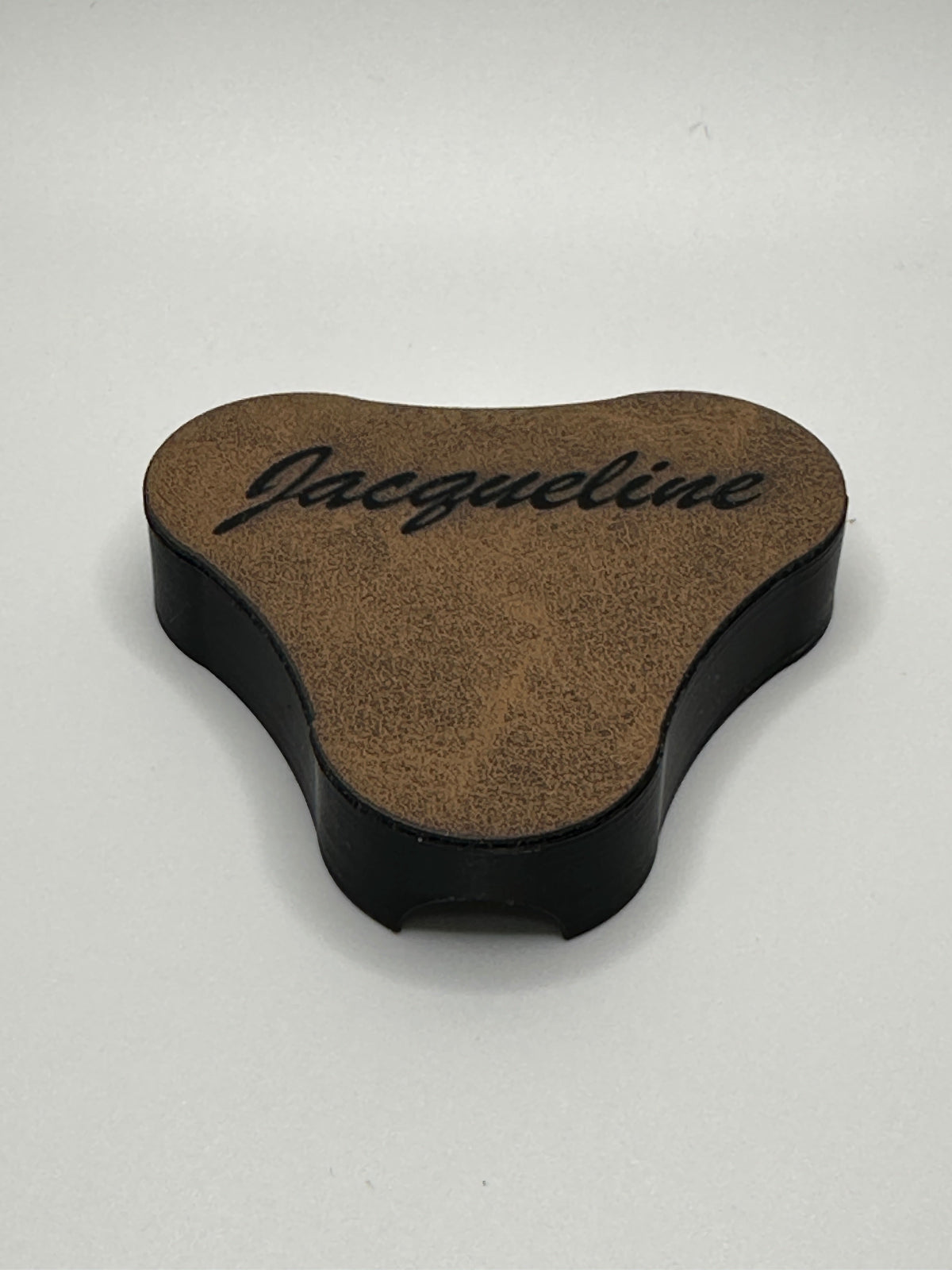 Leatherette backing with engraved text