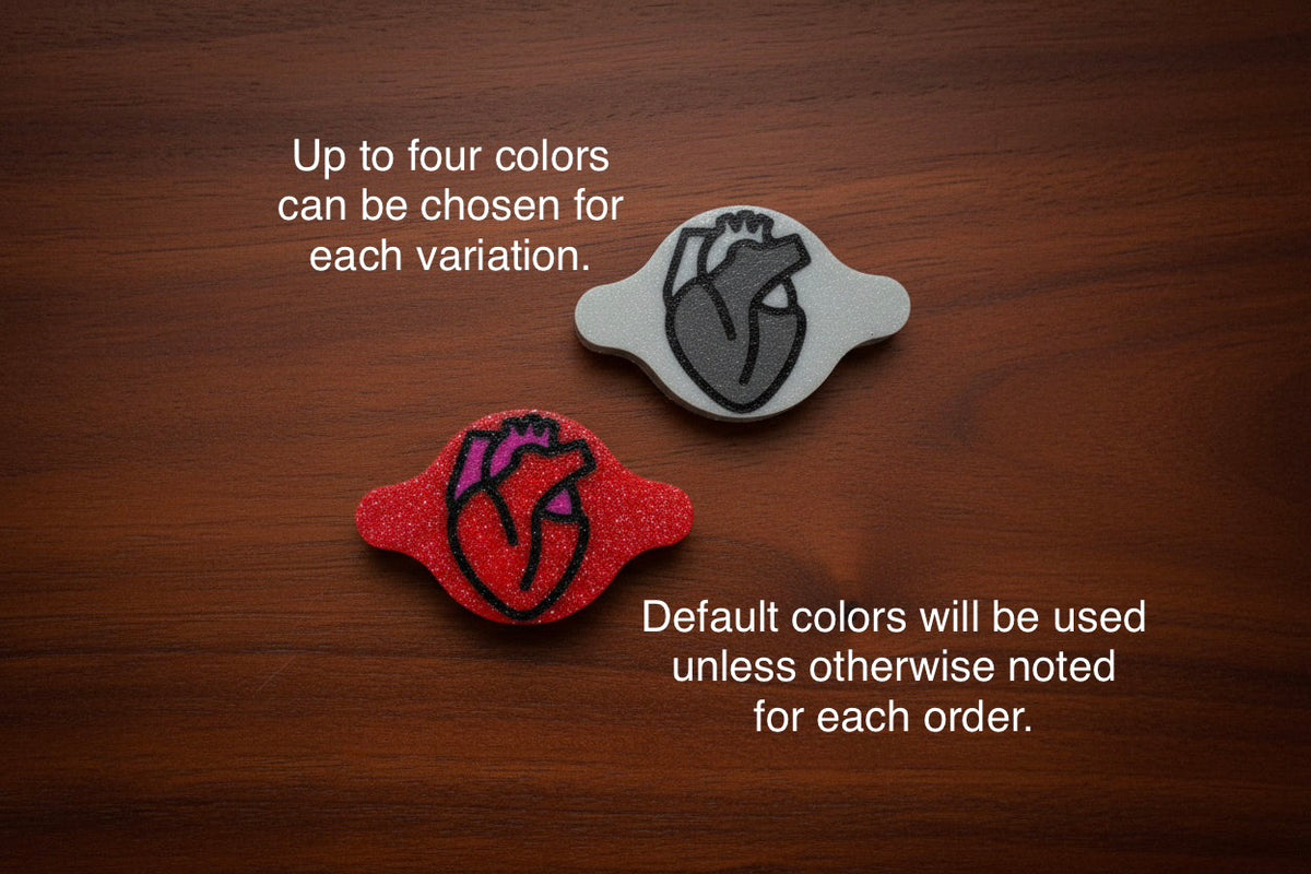 Red and black anatomical heart AirTag holders, with notes that up to four colors can be chosen and default colors are used unless noted