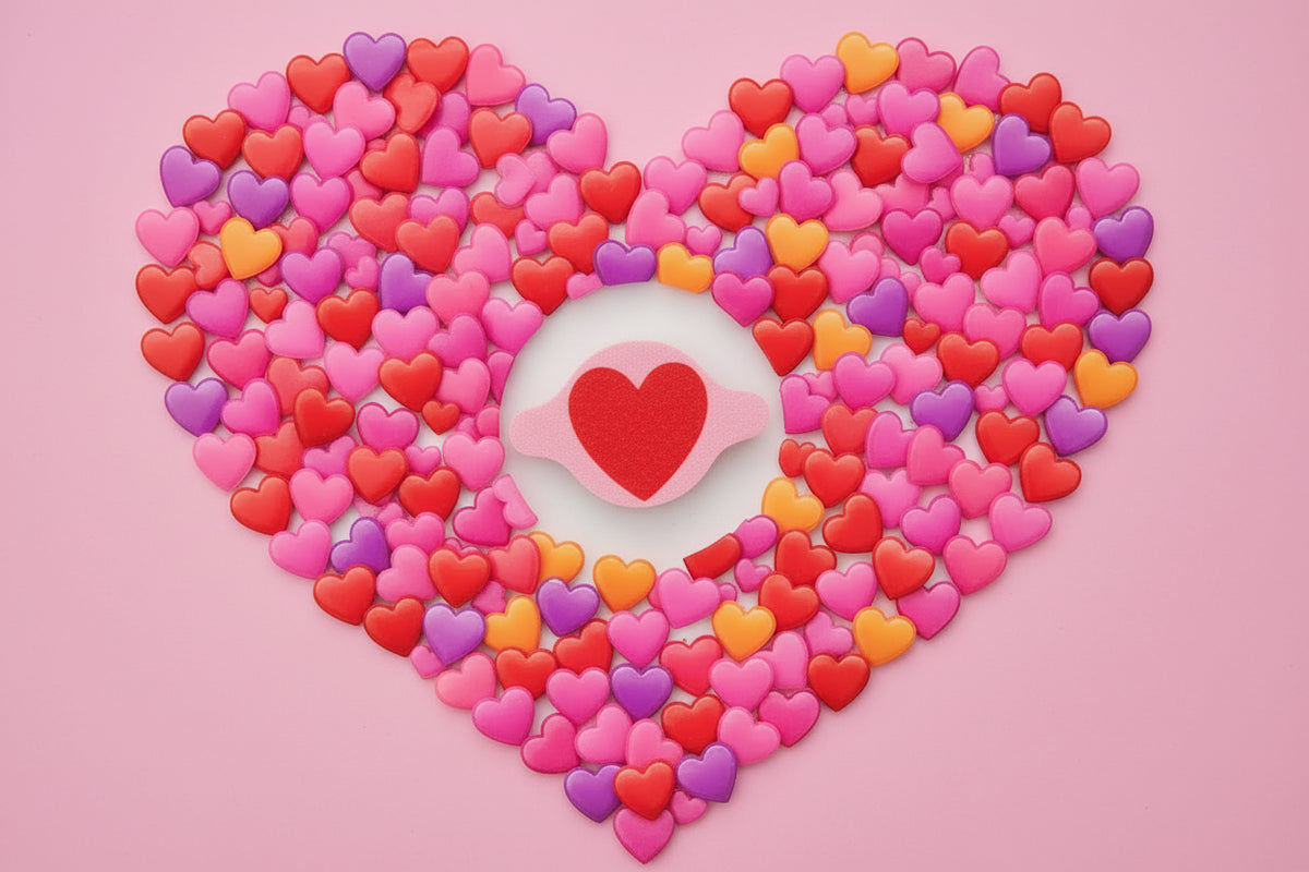 Round AirTag holder with a red heart, surrounded by candy hearts in a heart shape