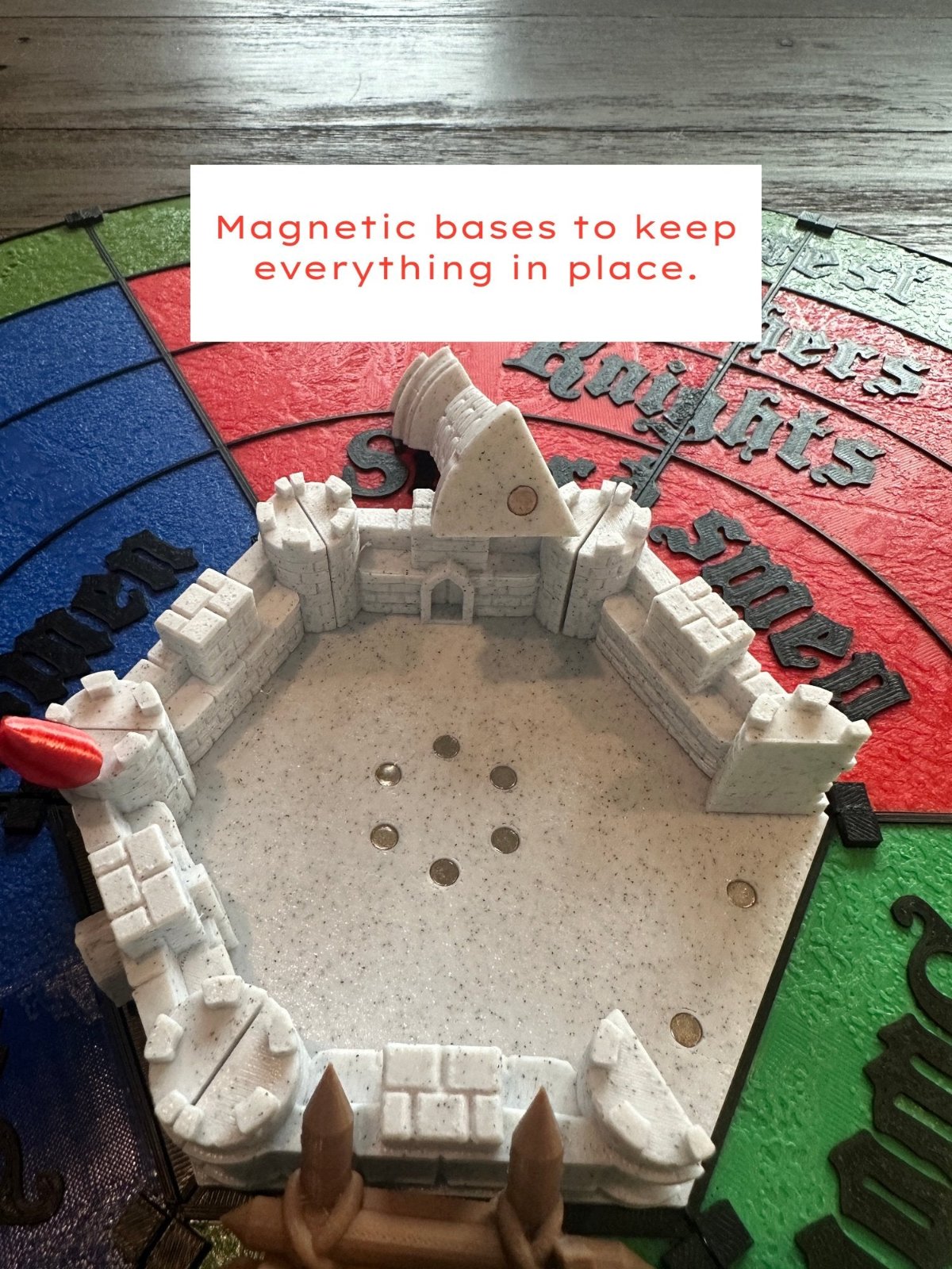 Ring of 3D printed Castle Panic walls and towers on magnetic bases on the game board