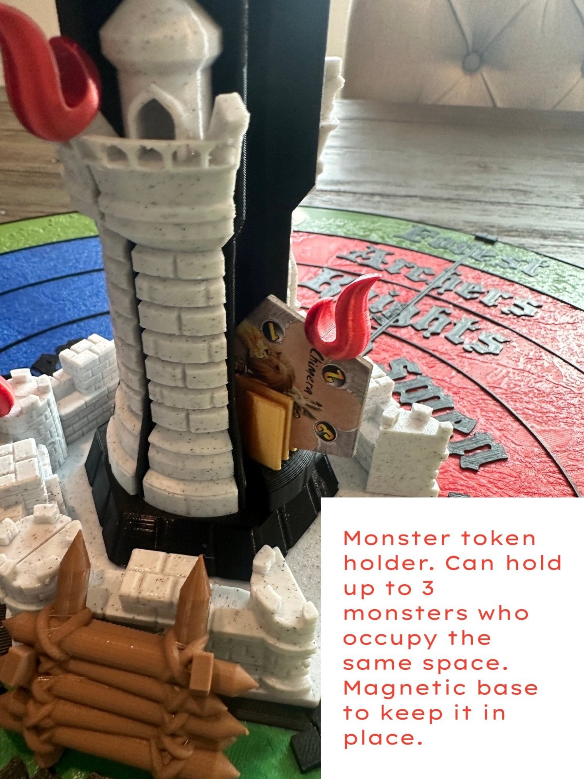 Castle Panic tower with a monster token holder that holds up to three monsters on a magnetic base