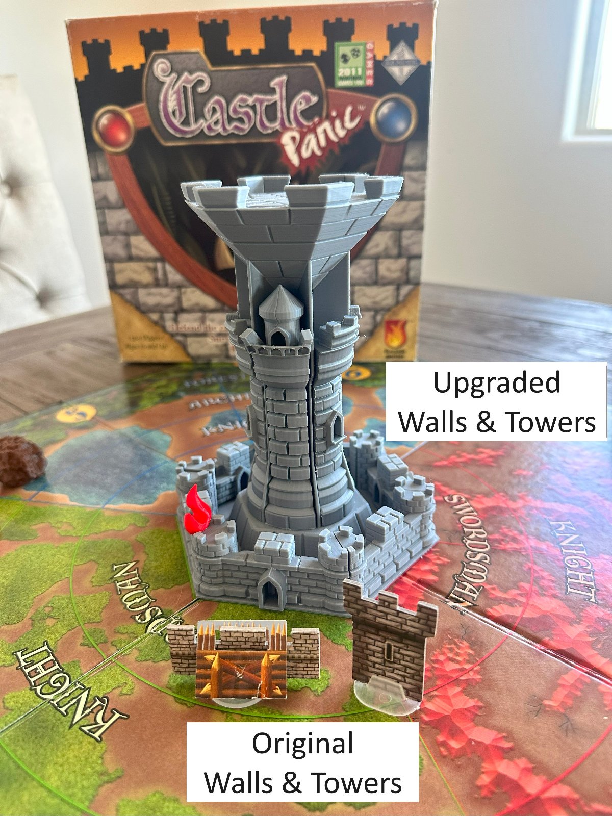 Comparison of upgraded 3D printed walls and towers next to the original cardboard walls and towers