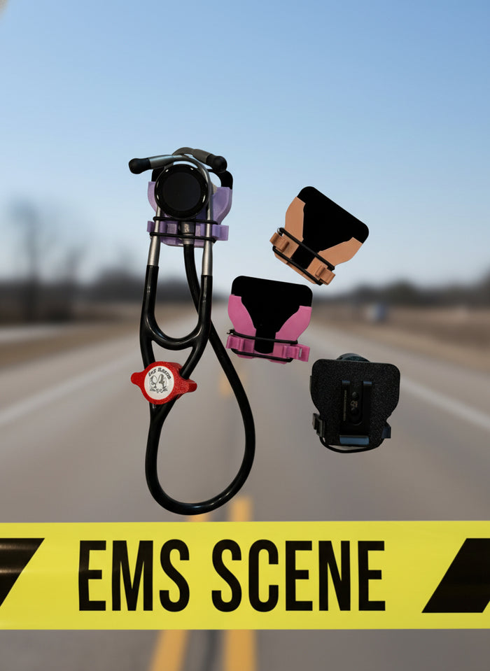 Littmann Eko 500 in a purple belt holster, with orange, pink and black holsters beside it, over a road with EMS Scene tape