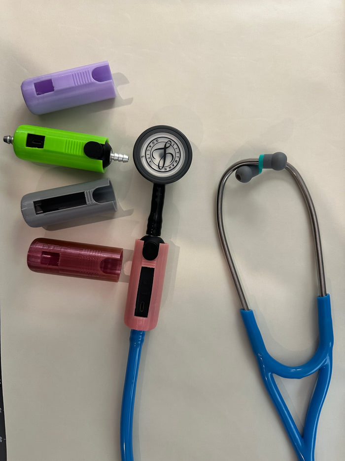 Several colored TPU covers for the Littmann Eko CORE next to a stethoscope with a cover fitted