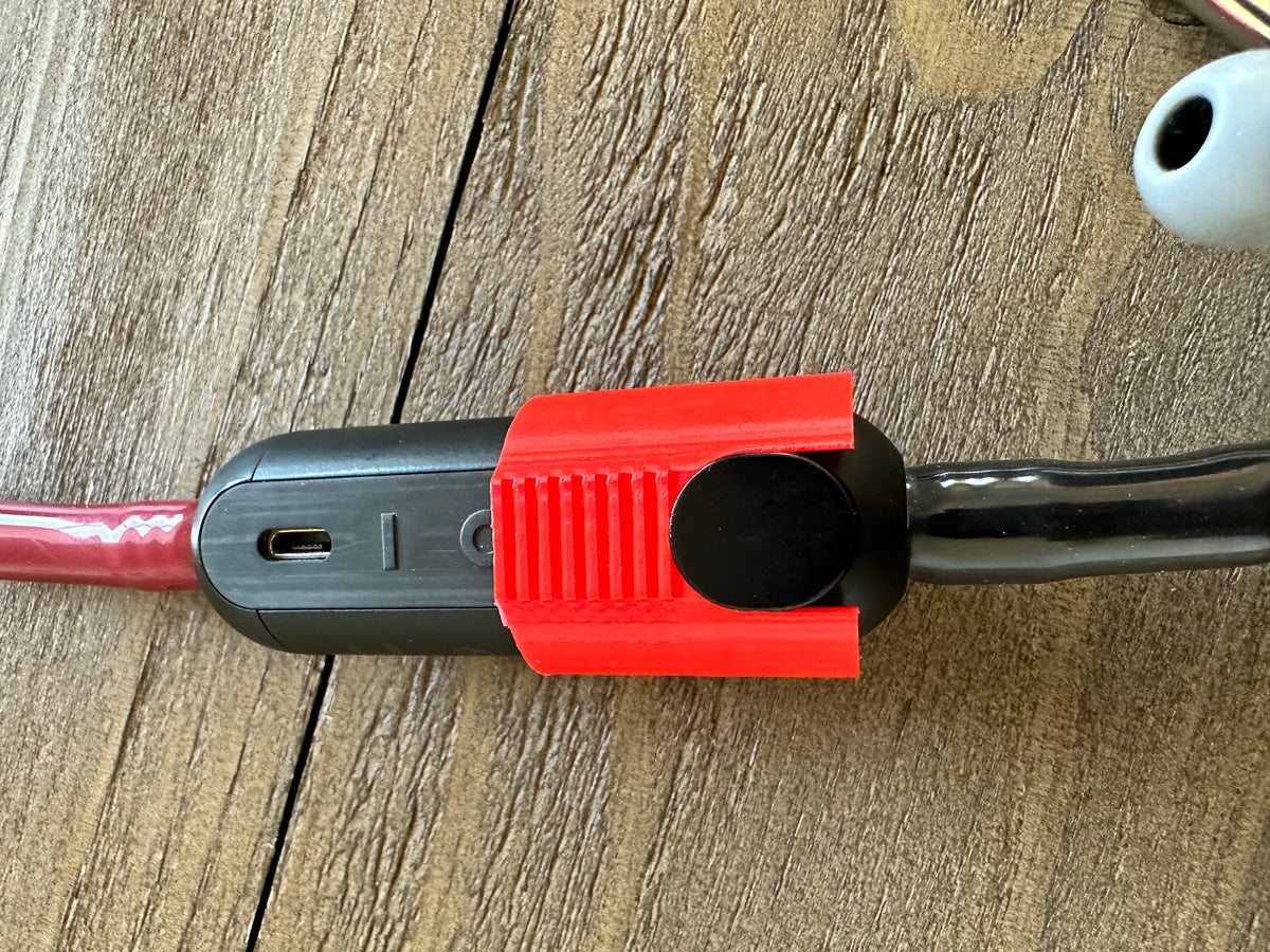Close-up of a red power blocker covering the power button on a Littmann Eko CORE