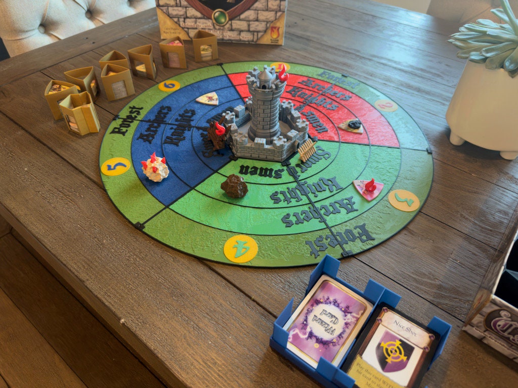 Castle Panic replacement board set up for play with cards and tokens around it