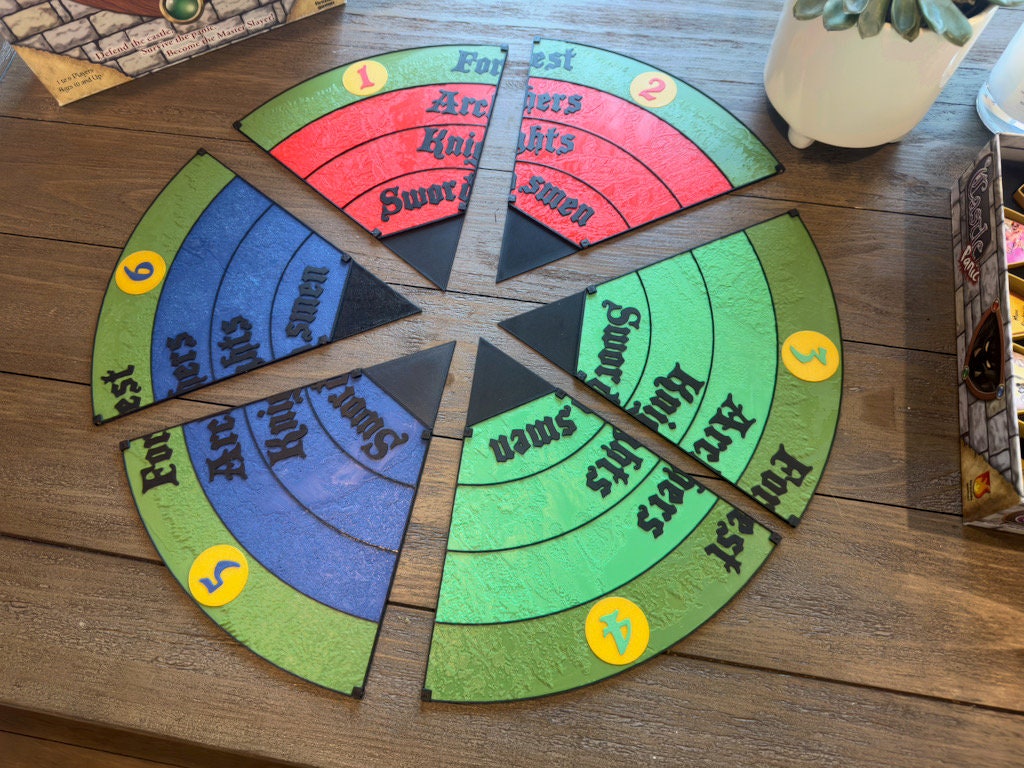 Six magnetic pieces of the round Castle Panic replacement board fitted together on a table