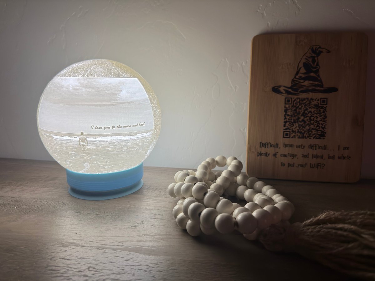 Glowing moon lamp on a shelf beside a wooden sign